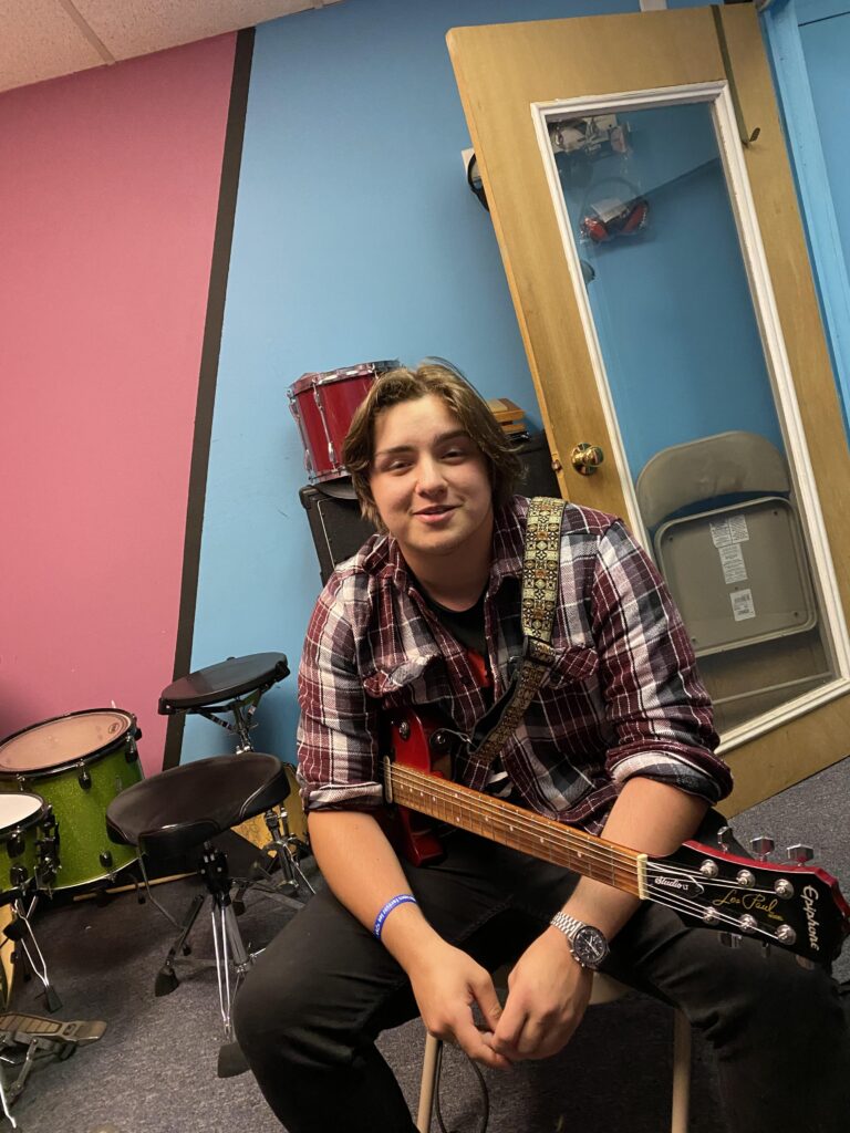 Aidan teaching at Jeff Denny's music station